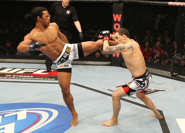 Henderson kicks Edgar UFC 144 Photo